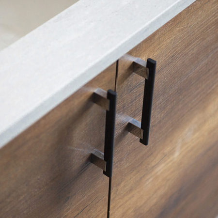 This modern metal and aluminum pull adds a sleek designer touch to cabinet doors and drawers.